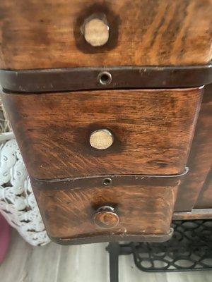 Antique sewing cabinet with knobs broken off