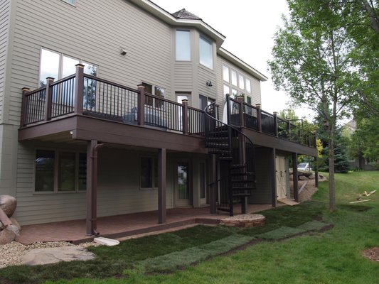 custom two level composite deck with 5 picture framed sections, spiral staircase, composite paver patio, dry space rain system, led lights