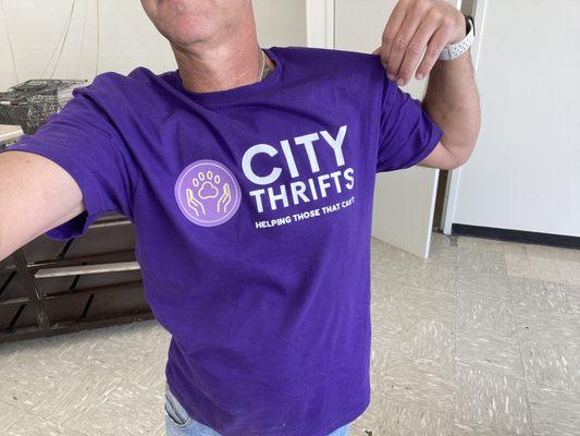 The owner showing off our new shirts!