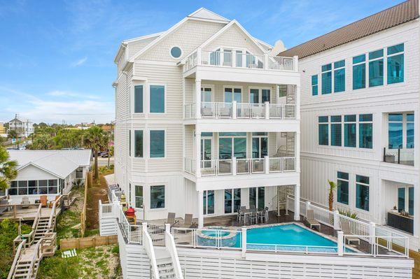 "Sea Breeze," is a newly built beachfront vacation rental (just completed Summer of 2020). This rental features 10 bedrooms & sleeps 38!