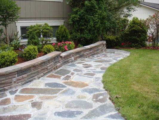 A stunning flagstone path and retaining wall we designed and installed.