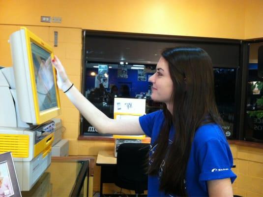 Shannon using one of the many helpful kiosks!