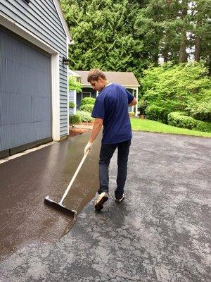 Driveway seal coat/resurfacing.