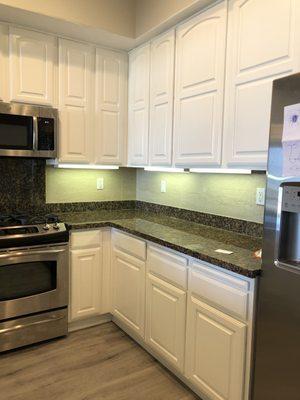 New white cabinets (originally dark cherry wood color)