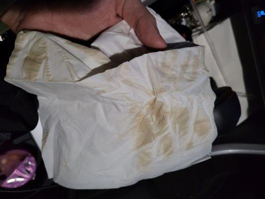 Coffee stain on the tissue after dabbing my cleaned car seat.