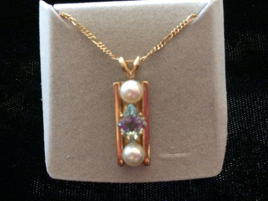 14 karat yellow gold, aquamarine and pearl pendant with 16" 14 carat gold chain. Custom designed piece.