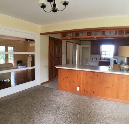 So much charm in this home.  Beautiful sun room with a wall of windows opens to kitchen with custom built cabinetry.