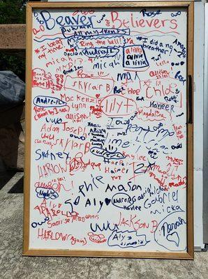 If you beat your time in a meet, you write your name down on this board, and ring a bell