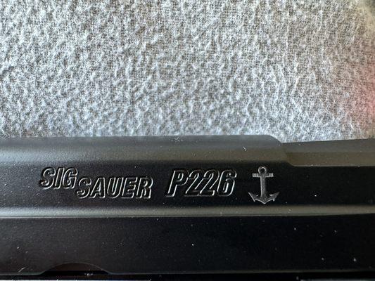 Reza laser-etched the anchor on the slide after cerakote.