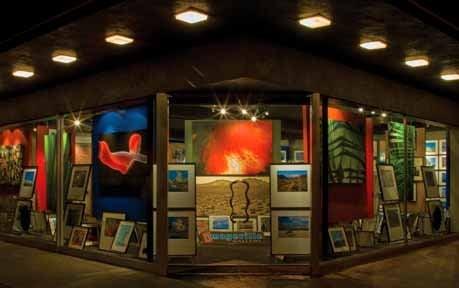 Imageville Gallery at night attracts customers who come back during the day when the gallery is open.