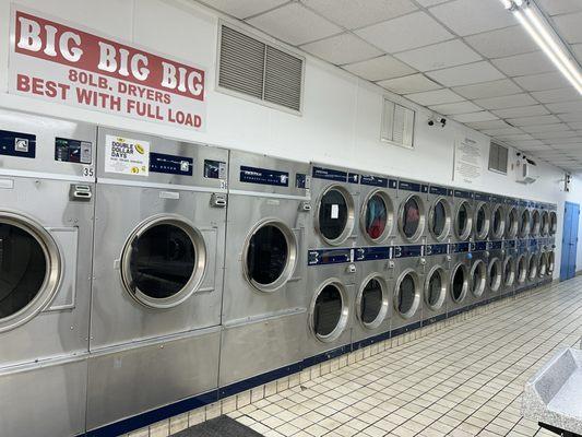 There are three really big dryers and two walls of smaller dryers