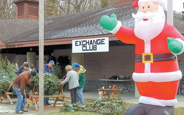 The Exchange Club will make a fresh cut on the trunk and tie the tree to your car roof.  Delivery is available.