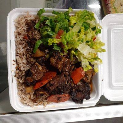 Oxtails and Rice and peas,  With a Toss Salad.