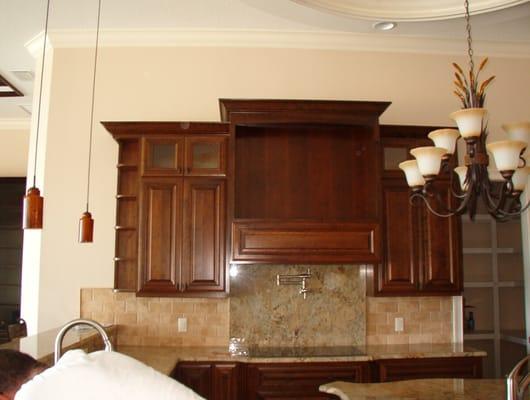 Cherry range hood and cabinets