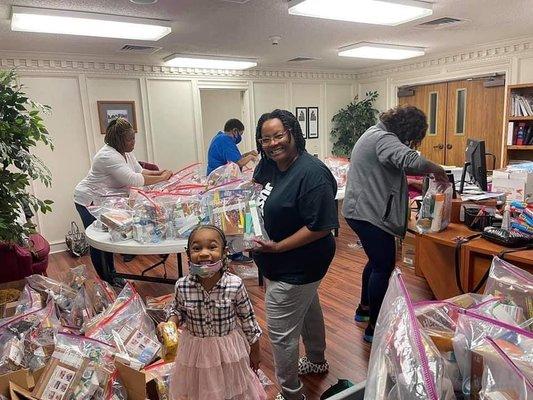 Missionaries putting together Care Packages for the homeless.