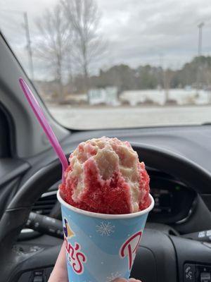 Strawberry snoball with condensed milk on top and ice cream in the middle!