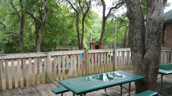 Outdoor play area, shaded.