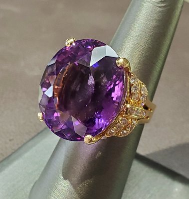 Large amethyst and round diamond accent ring in yellow gold