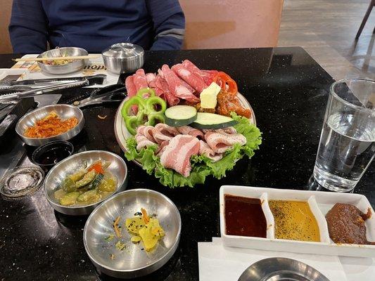 BBQ meats and dipping sauces. Middle one has always been my favorite - sesame oil and salt