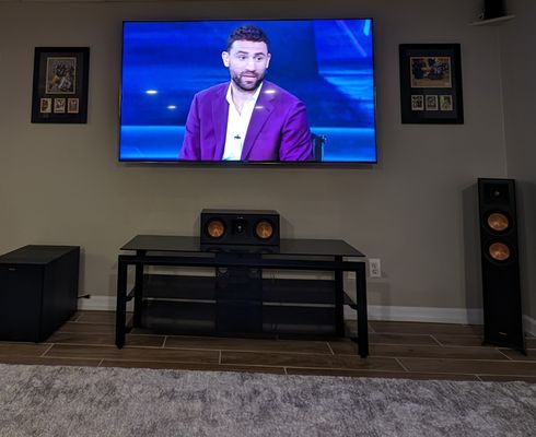 Wall mounted TV with no visible wires.