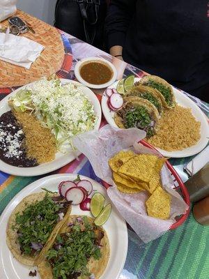 Pastor tacos, birria tacos, carne asada tacos, and empanadas.