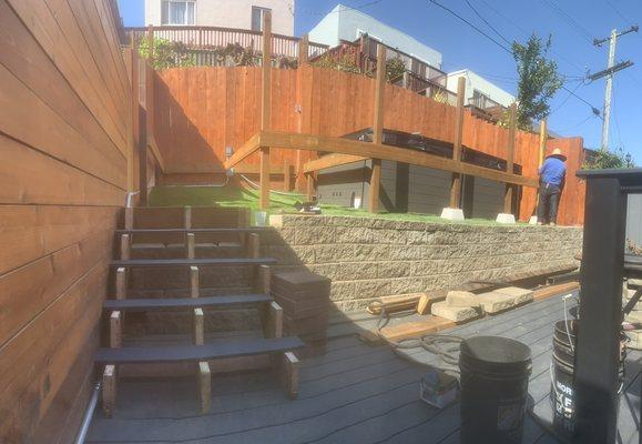 Placed turf down and made the base for the hot tubs deck