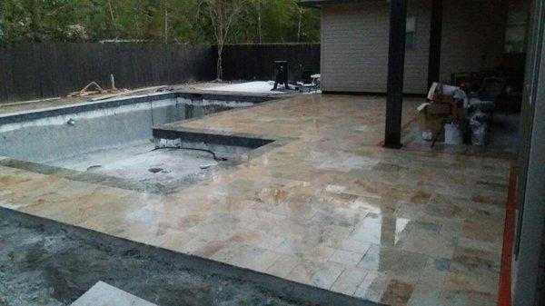 Travertine installed on new pool deck.