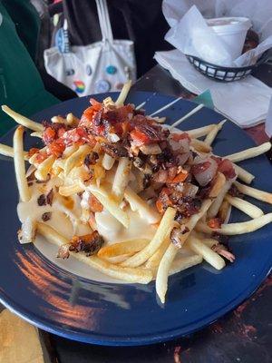 Loaded ponyshoe! There's a perfectly cooked piece of pork tenderloin under those loaded fries!