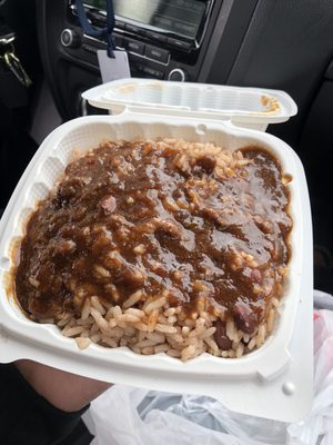 Rice and beans with oxtail gravy on top