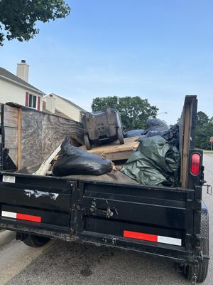 Broken down shed and yard debris