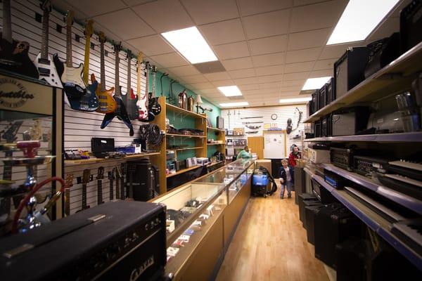 Here you can see our small head shop section, guitars, amps, small electronics and jewelry (which are in our display cabinets)