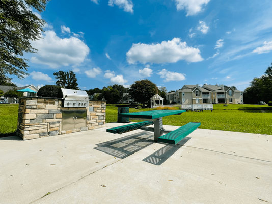 Outdoor Patio with grilling station at The Chase Apartment Homes located in Burlington, NC.