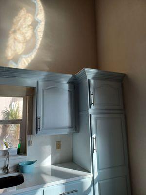 New cabinets with crown molding installed