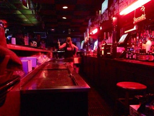 The single bartendress is very busy