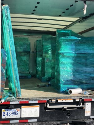 Furniture Bubble wrapped & Shrink Wrapped, then placed on Pallets ready to be shipped to the UK