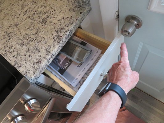 Kitchen drawer blocks the back door when in the open position.