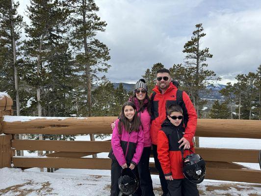 My family in our matching ski outfits from Kit Lender - girls in pink and boys in red!