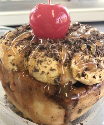 Java Rush- cinnamon roll with Coffee Frosting, chocolate shavings, caramel drizzle and a cherry.