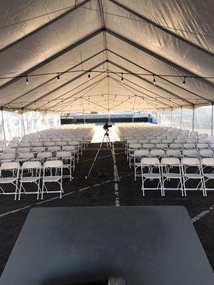 Inside of a 40' x 80' tent w/ clear sidewalls.