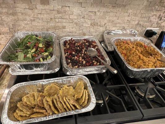 Meat paella, plantains, grain salad and green salad.