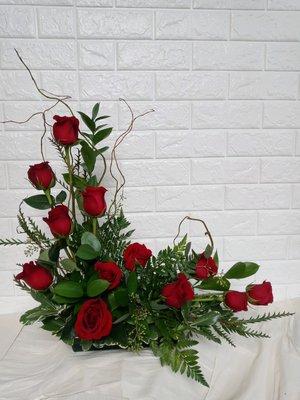 IN LOVE arrangement. One dozen roses for that special someone.  $89.99