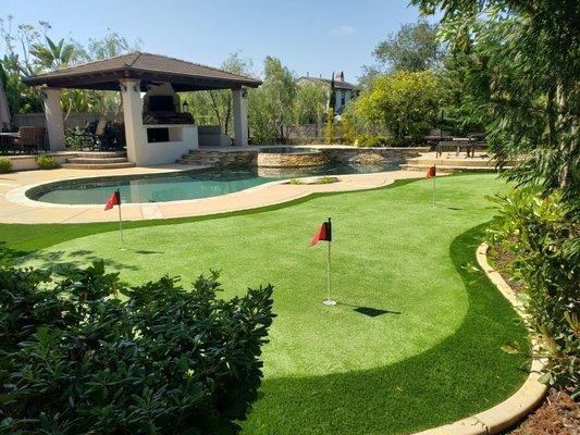 Custom putting green by pool in Seabrook Island