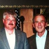 Owner Eric Hanna providing security for President George W. Bush when he visited our area.