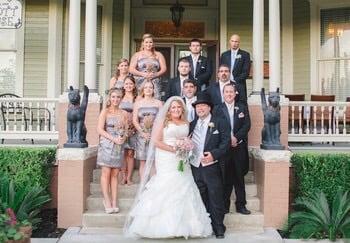 Bride and Groom with there wedding party on the front steps      of The Abbott House.