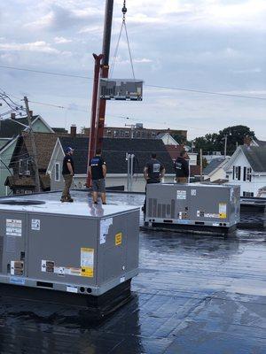 Installation of 12 new Package Gas Electric Carrier Rooftops In Gloucester.