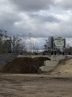 The sign and mulch retaining walls