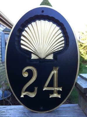 Custom carved house number with shell