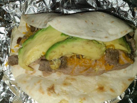 Bean and cheese breakfast taco add sausage and avacado.