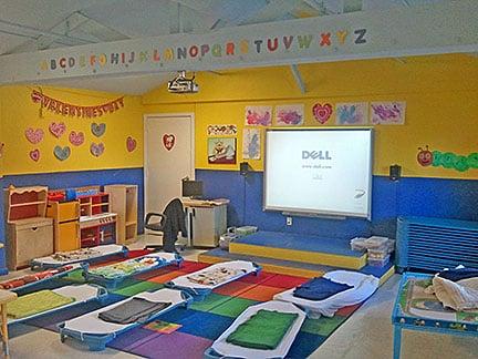 Classroom with cots and FasTrack Learning Station.