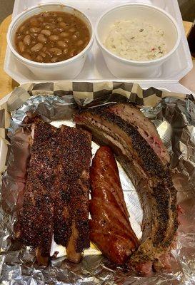 3 meats: pork ribs, sausage, brisket.  Low and slow to perfection.